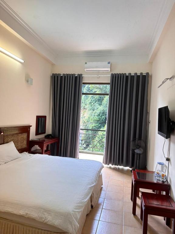 Postel nebo postele na pokoji v ubytování An Phú Motel Tam Đảo