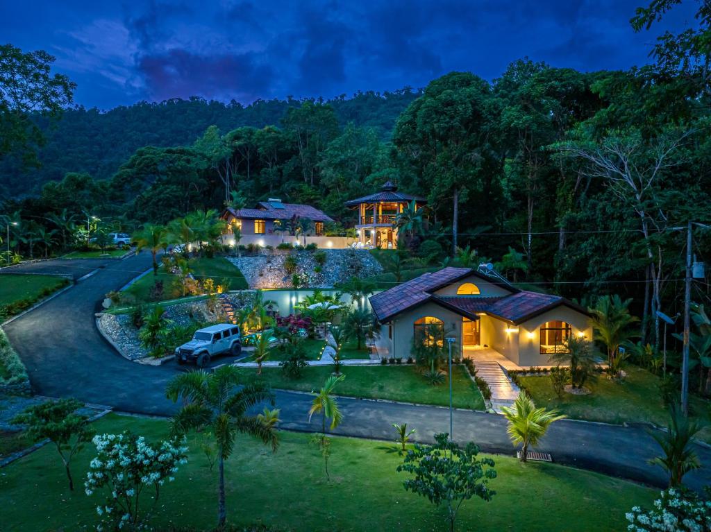 an aerial view of a house in the forest at night at Las Palomas Villas Of Uvita in Uvita