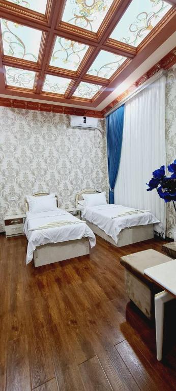 A bed or beds in a room at sheykh hotel