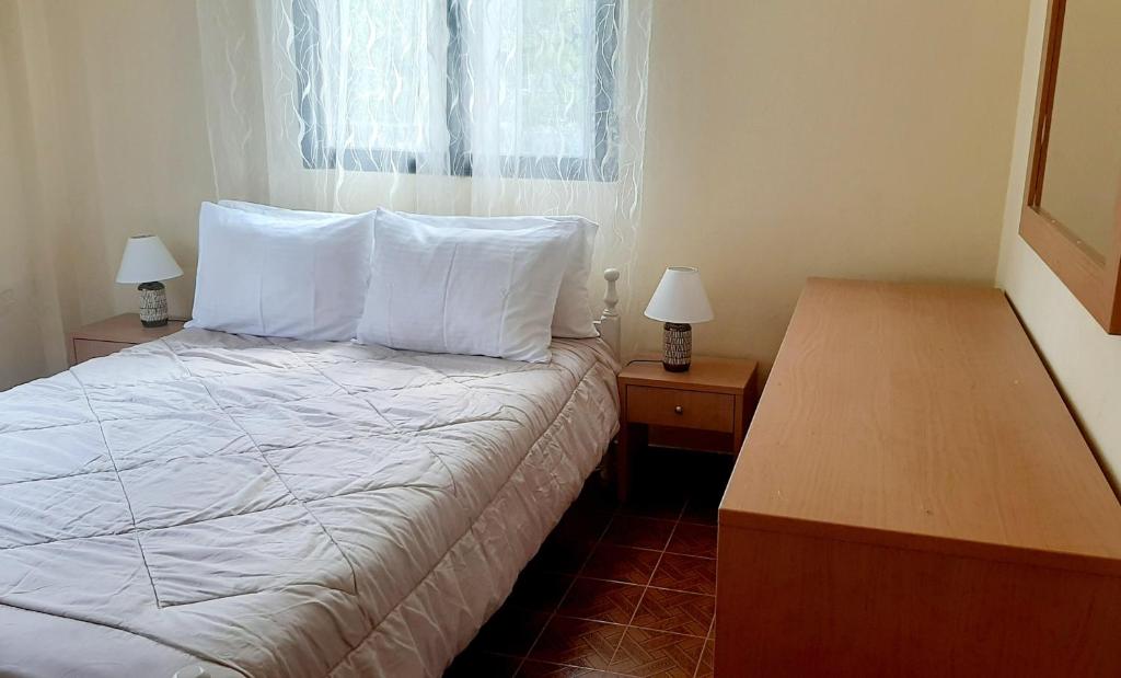 Postel nebo postele na pokoji v ubytování Liberty Homes ,Ai Gordis Notou