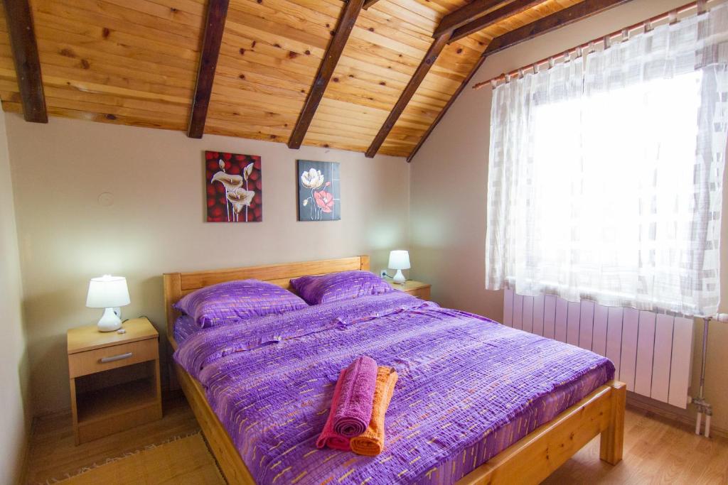 Postel nebo postele na pokoji v ubytování Apartments Andrić