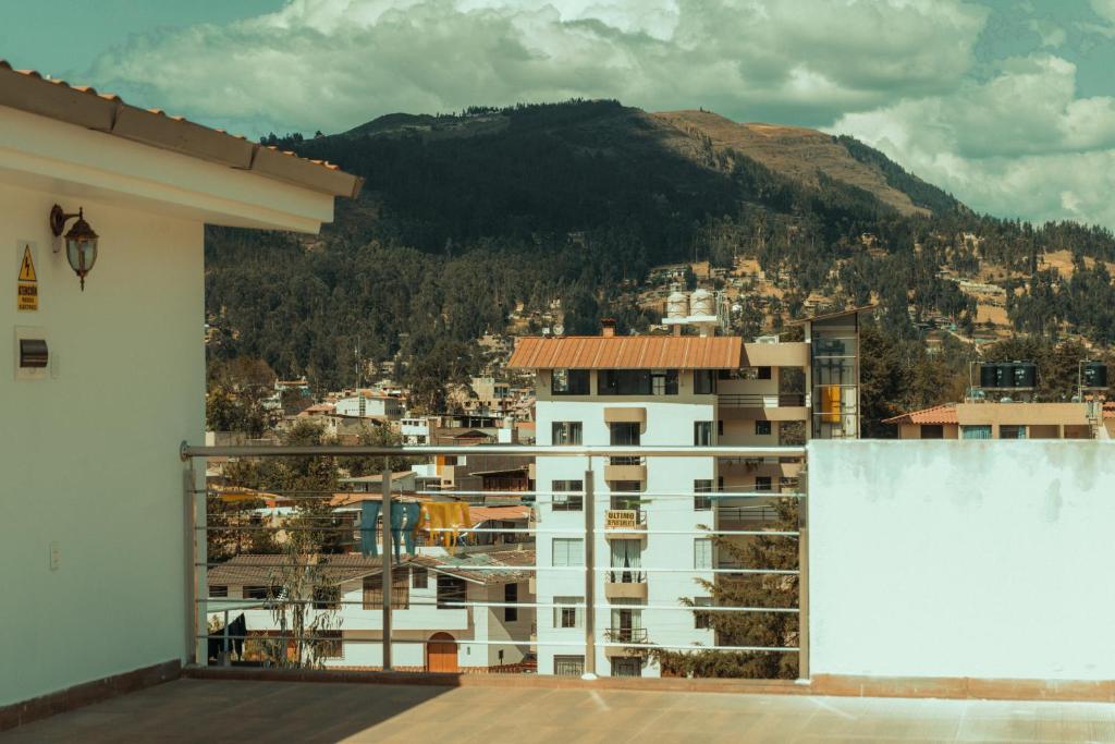 a view of a city from the balcony of a building at Redwalls Lodge in Cajamarca