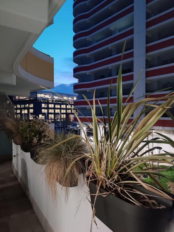 a row of potted plants on a balcony at Pirelli 28 in Milan