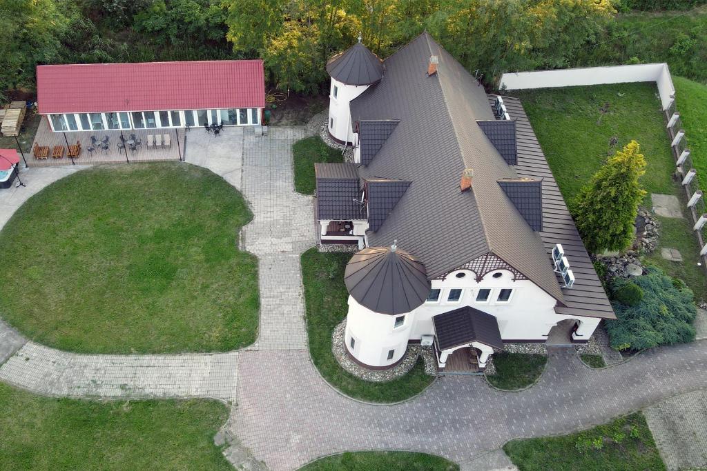 an aerial view of a house with a yard at The Luxo Wine Museum Hotel in Kaba