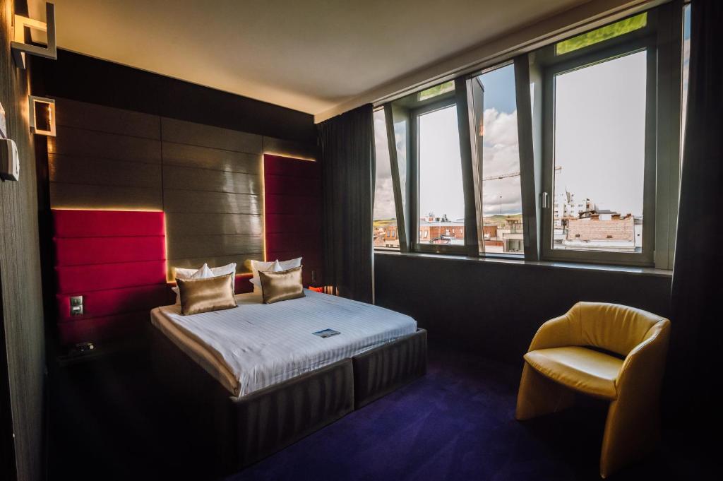 Postel nebo postele na pokoji v ubytování Plaza V Hotel