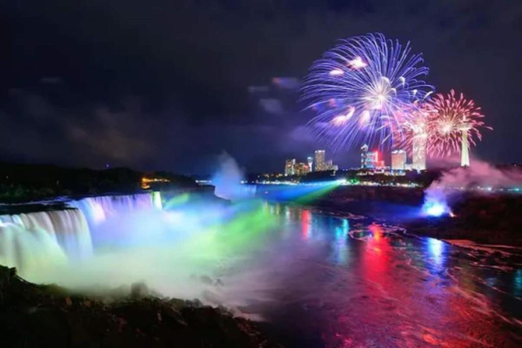 a firework display over the niagara falls at night at Stylish Townhome Gem with Several Amenities Just Minutes To The Falls in Niagara Falls