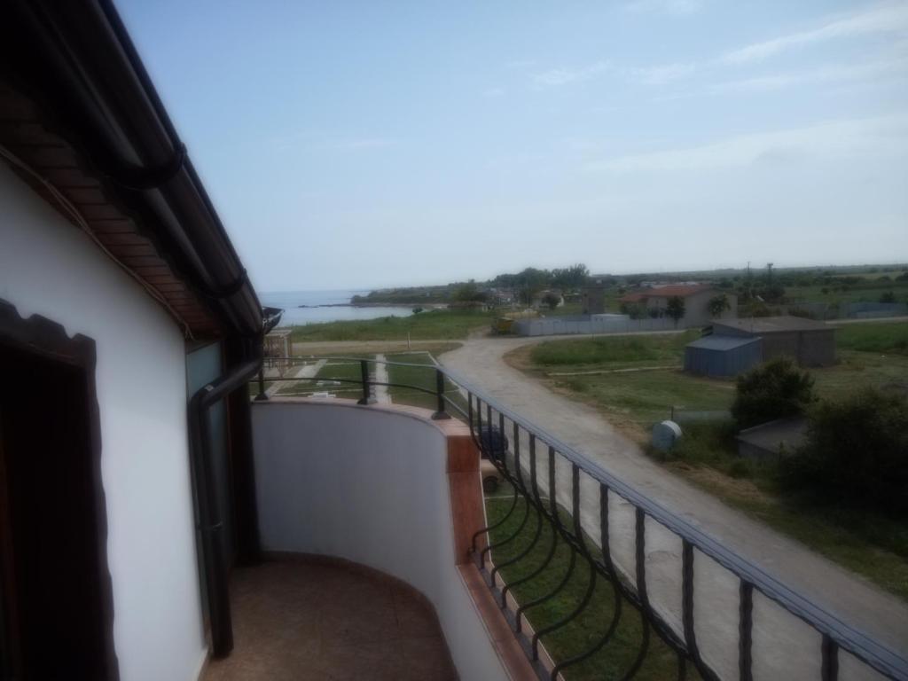 a balcony with a view of a road at Guest Rooms Ribarska Hizha in Shabla