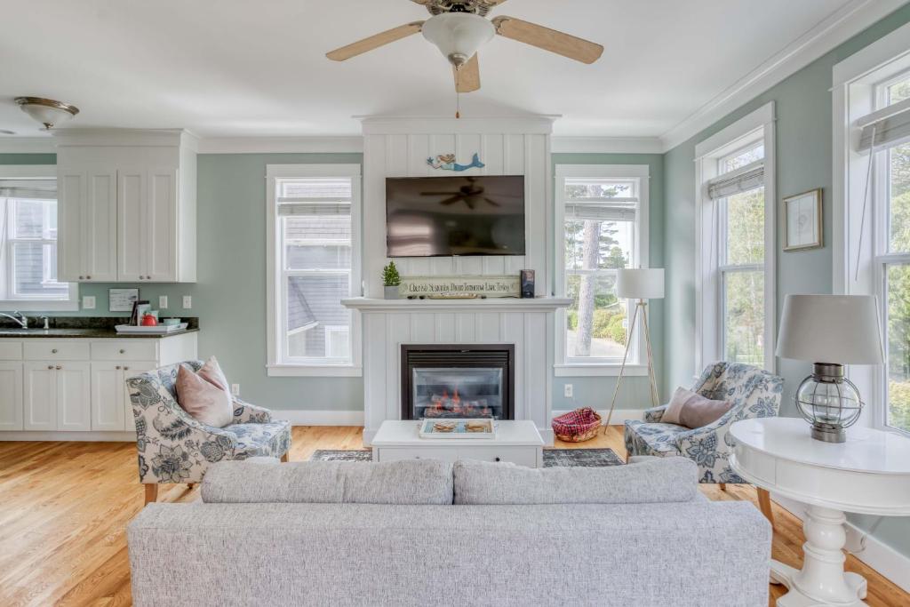 a living room with a couch and a fireplace at Mertini in Depoe Bay
