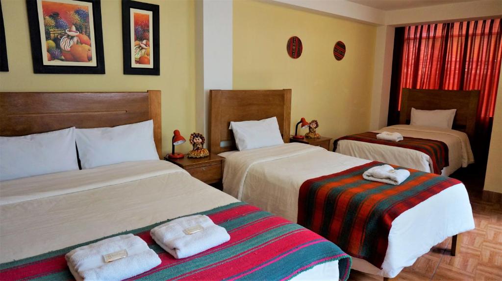 Letto o letti in una camera di Eco Aventura Hostel Cusco