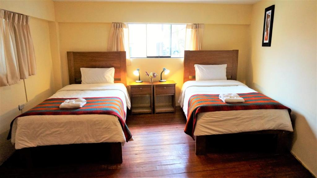 Letto o letti in una camera di Eco Aventura Hostel Cusco