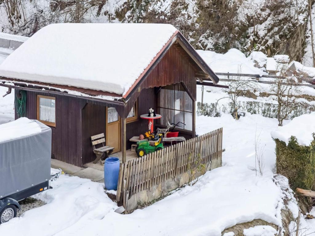a snow covered house with a toy in it at Apartment Feld am See near Feldsee Lake in Feld am See