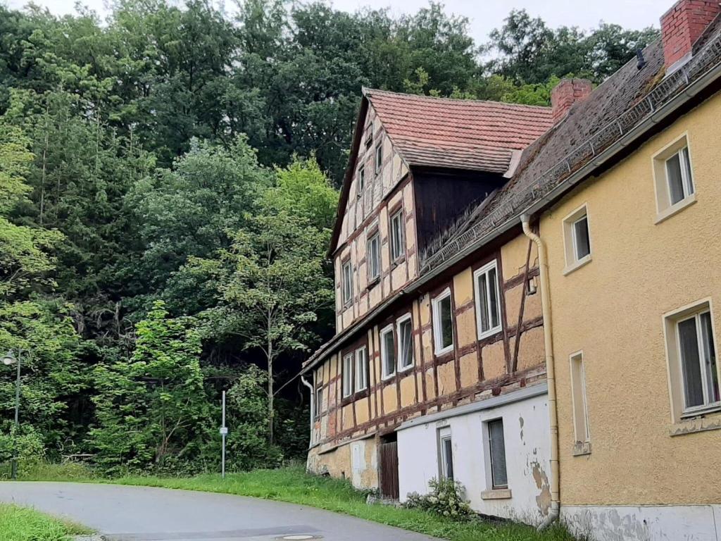 an old wooden building with a gambrel at Property in Burgk in Burgk
