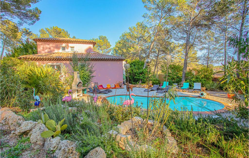 a house with a swimming pool in a garden at Beautiful Home In Les Arcs With Wifi in Trans-en-Provence