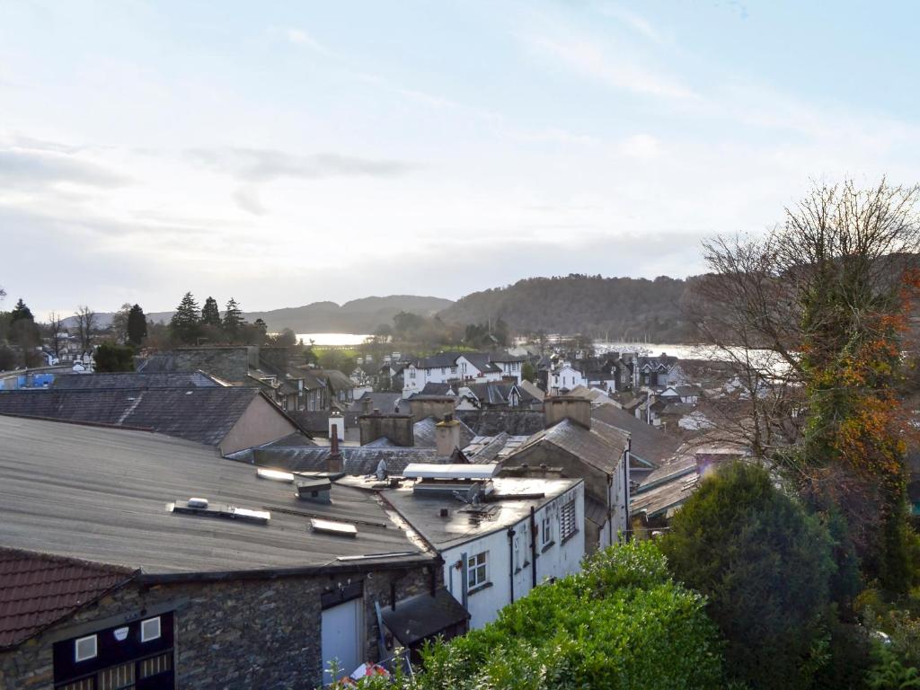 a view of a town with houses and the water at Lake View in Bowness-on-Windermere