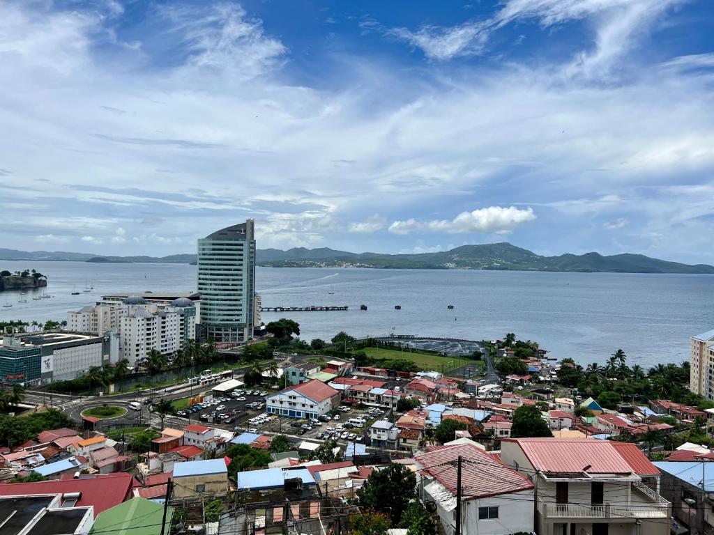 an aerial view of a city next to the water at Bella Apartment in Fort-de-France