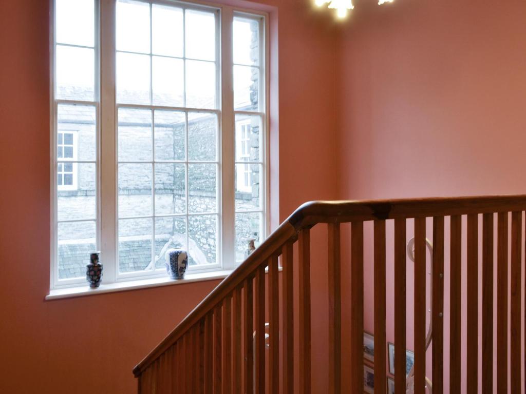 a staircase in a house with a window at Apartment 3-uk33247 in Grayrigg