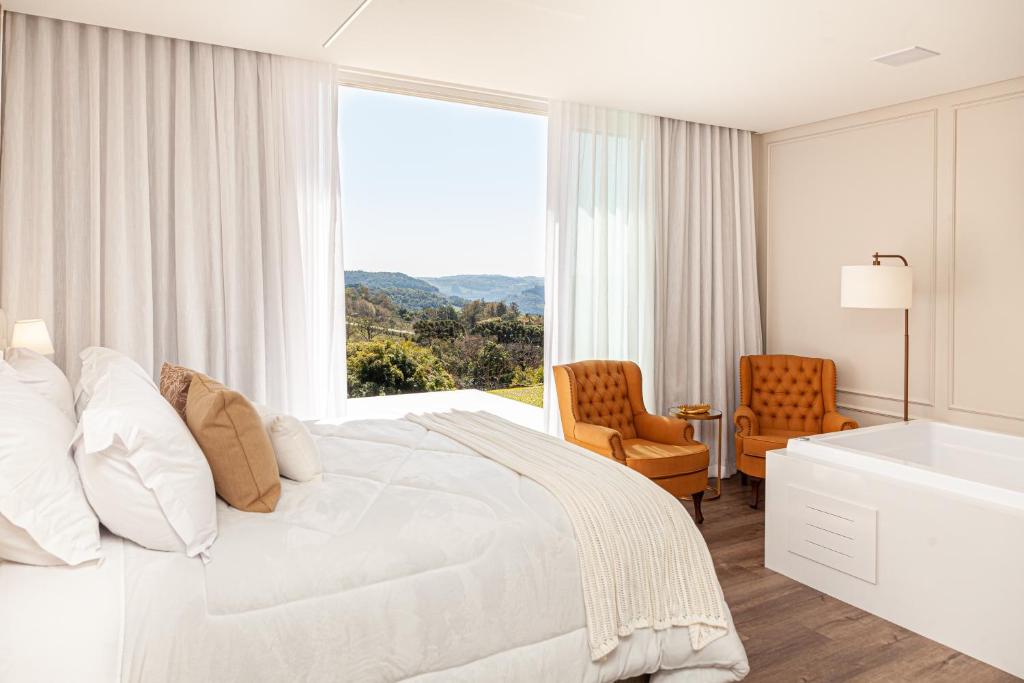 Postel nebo postele na pokoji v ubytování Villa Toscana - Vale dos Vinhedos