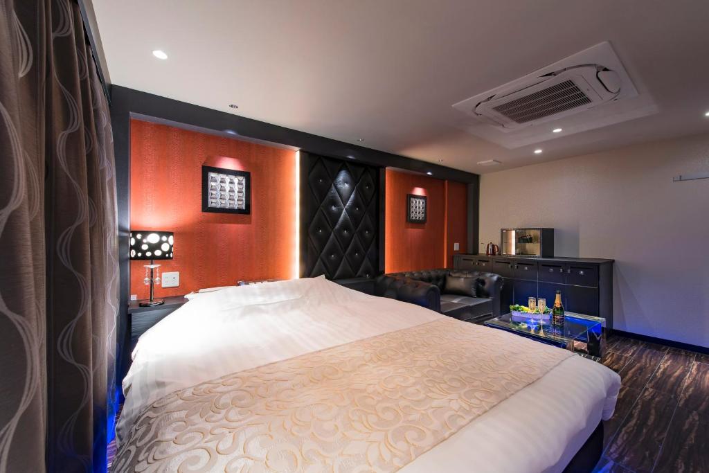 Postel nebo postele na pokoji v ubytování HOTEL COSTA RESORT Omiya