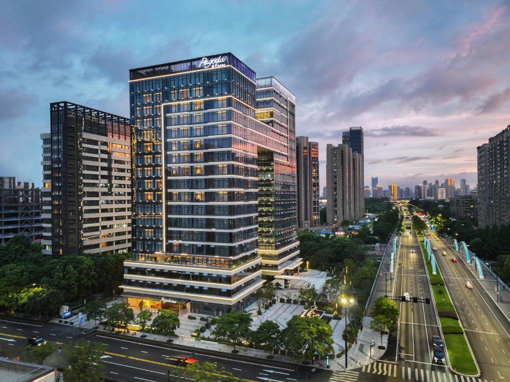 a rendering of a tall building in a city at Pagoda Hotel Hangzhou Binjiang in Hangzhou