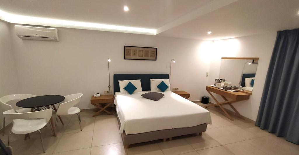 Postel nebo postele na pokoji v ubytování Apollon Hotel