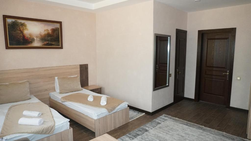 Postel nebo postele na pokoji v ubytování Classic Hotel