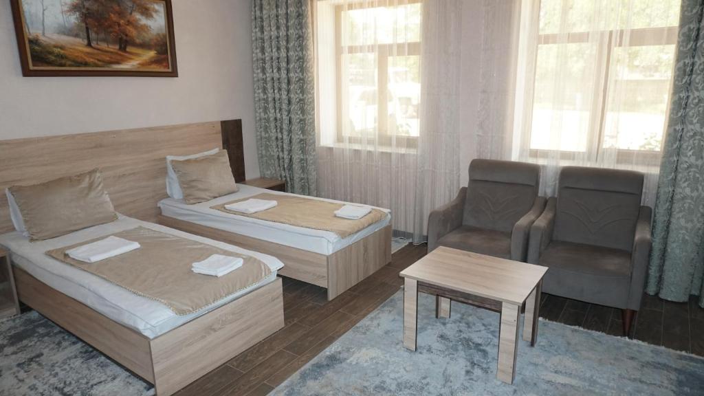 Postel nebo postele na pokoji v ubytování Classic Hotel