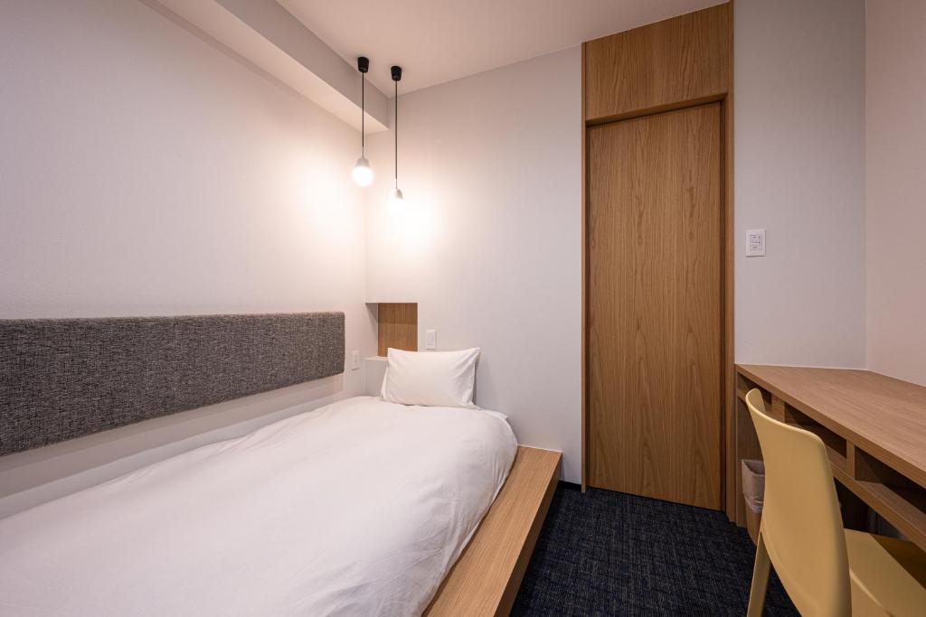 Postel nebo postele na pokoji v ubytování plainn by negura