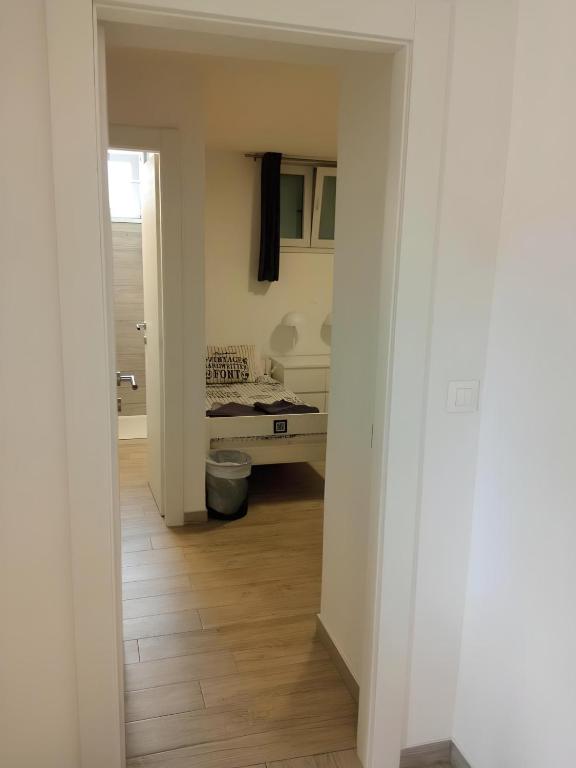 an empty hallway with a room with a desk in it at Apartment Patrik in Vabriga