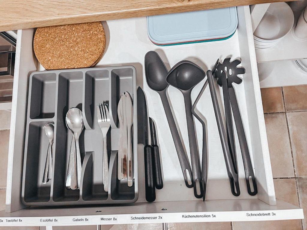 a drawer filled with utensils on top of a counter at Granny Smith in Neuhofen