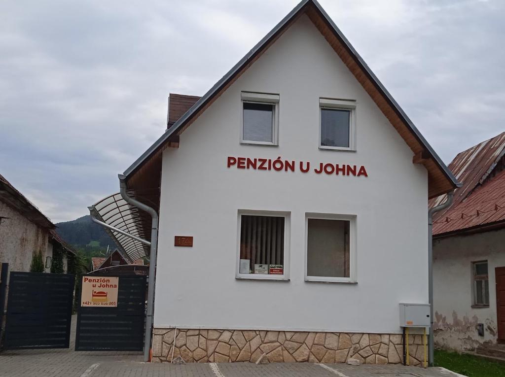 a white building with a sign that reads pavilion u juana at Penzión U Johna in Vyšné Ružbachy