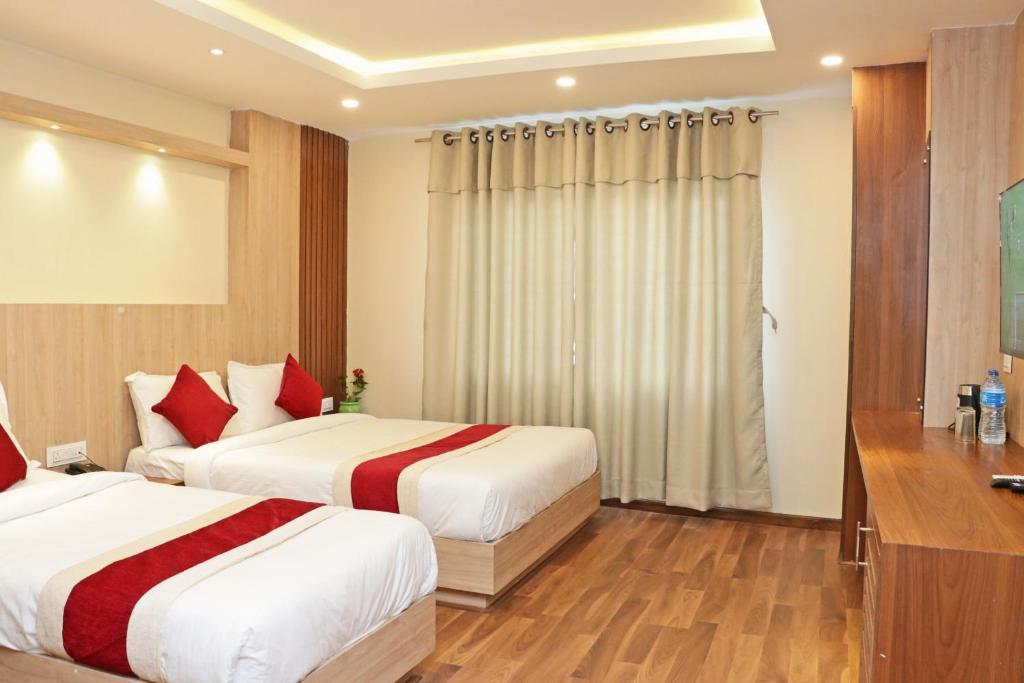 Postel nebo postele na pokoji v ubytování Hotel Nilakantha Pvt. Ltd