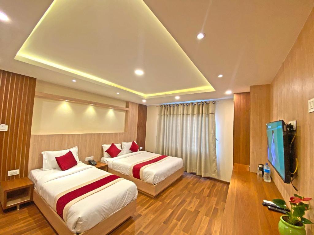 Postel nebo postele na pokoji v ubytování Hotel Nilakantha Pvt. Ltd
