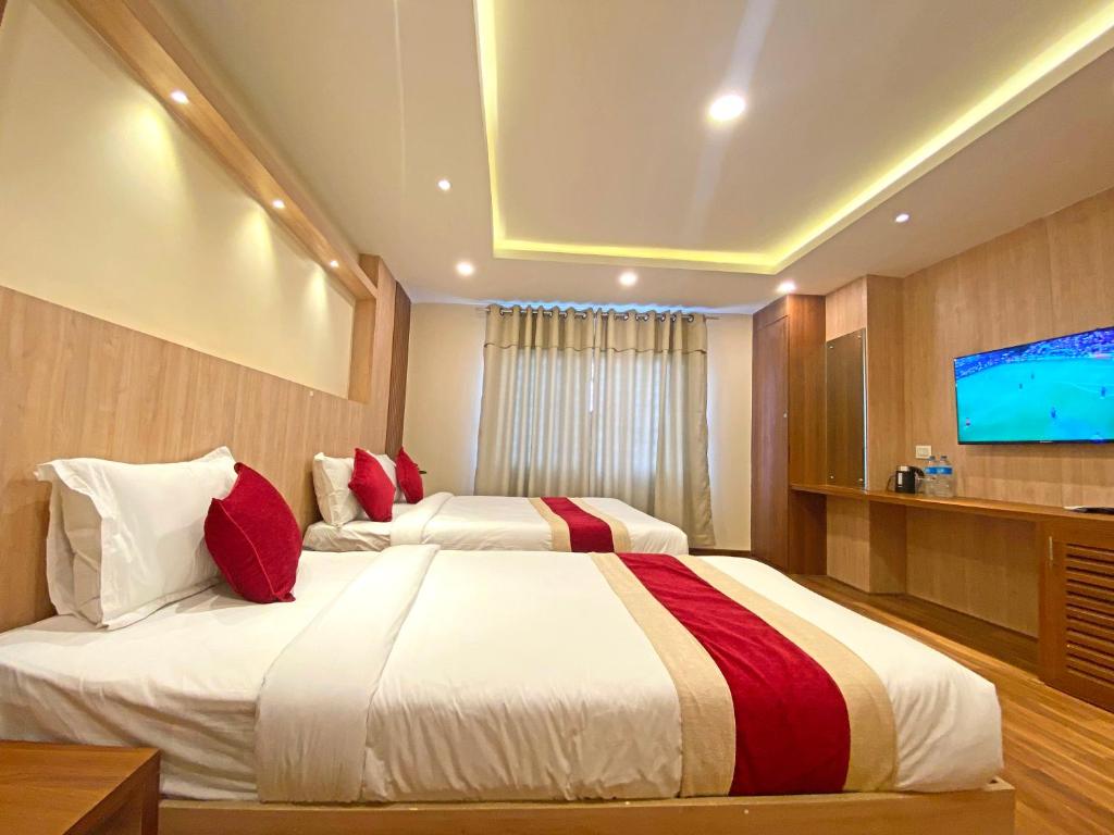 Postel nebo postele na pokoji v ubytování Hotel Nilakantha Pvt. Ltd