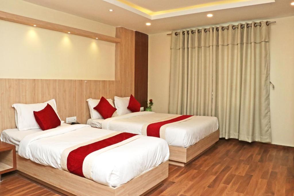 Postel nebo postele na pokoji v ubytování Hotel Nilakantha Pvt. Ltd