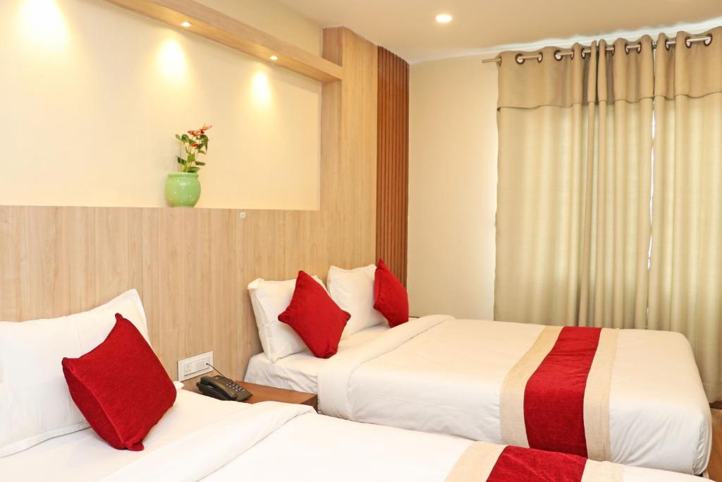 Postel nebo postele na pokoji v ubytování Hotel Nilakantha Pvt. Ltd
