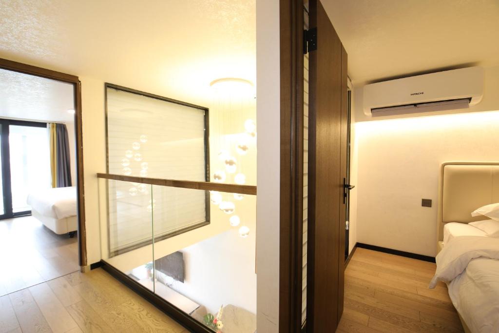 Postel nebo postele na pokoji v ubytování Xinghe Times Apartment - Shenzhen North Railway Station