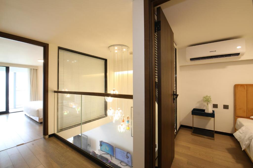 Postel nebo postele na pokoji v ubytování Xinghe Times Apartment - Shenzhen North Railway Station