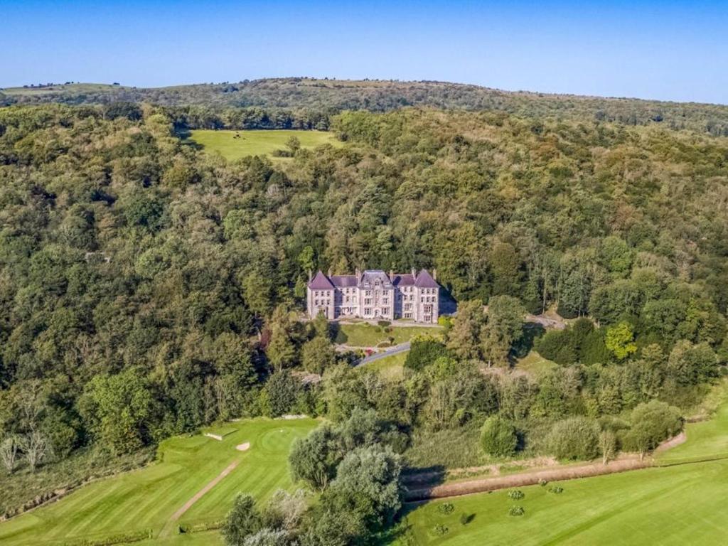 an aerial view of a large house on a hill at Pass the Keys Yew Tree Stunning Apartment with Sea View in Grange Over Sands