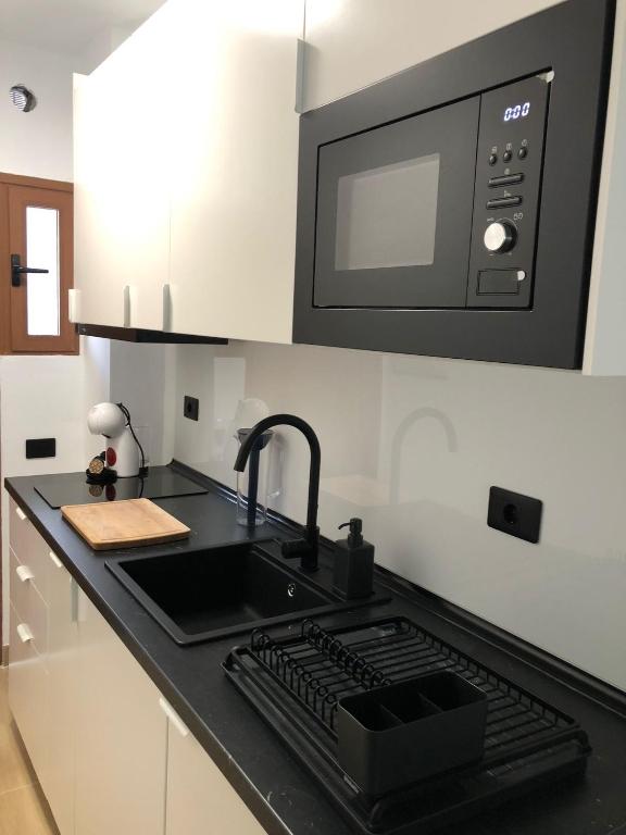 Kuchyň nebo kuchyňský kout v ubytování Tu apartamento en vacaciones
