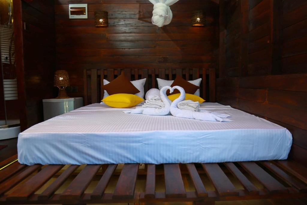Postel nebo postele na pokoji v ubytování Coco Palm Villa and Cabanas