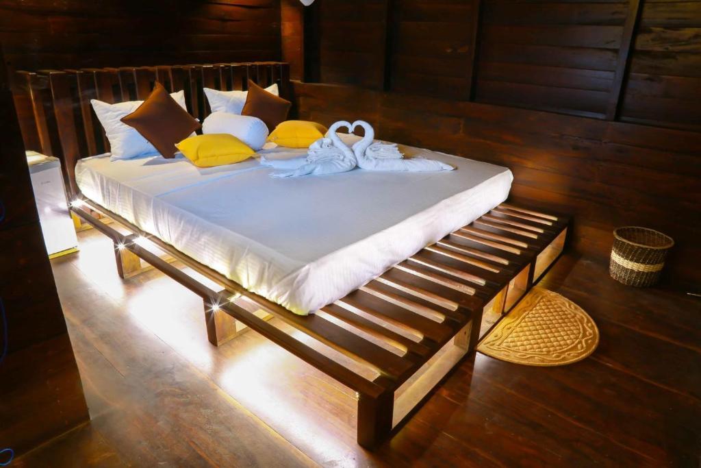Postel nebo postele na pokoji v ubytování Coco Palm Villa and Cabanas