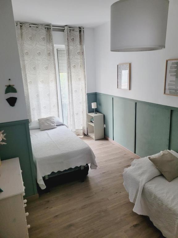 Posteľ alebo postele v izbe v ubytovaní Apartment in the center of Seville