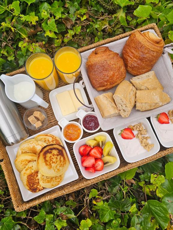 a tray of bread and pastries on a table at Gite "RIO", parking securise in La Roche-sur-Yon
