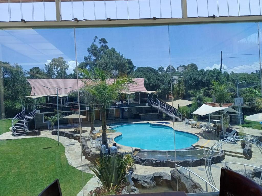 a view of a swimming pool in a resort at Brooks Lodge in Nakuru