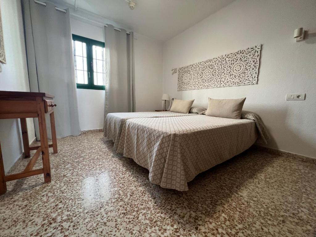 Posteľ alebo postele v izbe v ubytovaní Apartamentos Acuario Sol