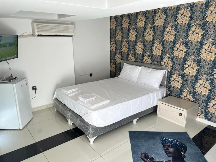 a bedroom with a bed and a tv in it at Africa in the heart of city center in Antalya