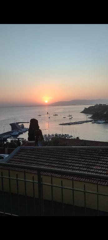 a sunset over a harbor with boats in the water at La casa di Rosy in Porto Santo Stefano