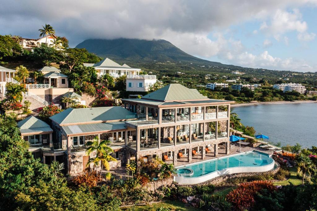 an aerial view of a resort with a swimming pool at Beautiful 3 story 8,000 sq ft Oceanside Mansion in Nevis