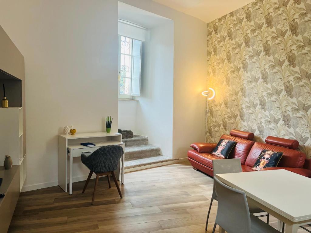 a living room with a couch and a table at Loft Eburnea 13 in Perugia