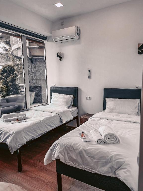 Postel nebo postele na pokoji v ubytování Apple cozy hotel